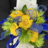   A corsage with a slap-on bracelet combines traditional elegance with