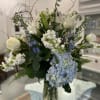 This beautiful mixture of blue and white flowers is calming bouquet that