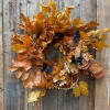 Beautifully preserved, golden beech leaves, adorned with bittersweet vine and small butterflies.
