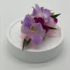 This is a premium orchid corsage. We add in beautiful seasonal premium
