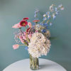 Elevate any occasion with our premium seasonal fresh blooms, artfully arranged with