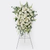 A timeless design featuring a mix of premium and seasonal white blooms