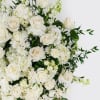 A timeless design featuring a mix of premium and seasonal white blooms