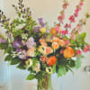Send a confetti of color with this beautiful arrangement!  This is