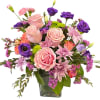 Roses, Lisianthus, Carnations with greenery in a clear vase 