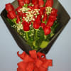 Gathering of one dozen red roses. Radiant. Timeless. Romantic. There&rsquo;s something so