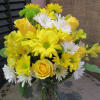 Vase of yellow, white and greens featuring roses, daisies and buttons.