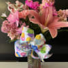fresh flowers in vase with birthday ribbon 