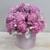 A lavender hatbox overflowing with pink peonies! Peonies are one of our