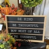 Be Kind and other words of wisdom are displayed on this chalkboard