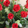 36 long stem red roses with mixed greenery in a clear cylinder