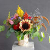 In this arrangement are our beautiful red and yellow sunflowers that looks
