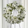 Wreath with white daisies, spray and regular roses, white carnations, white stock