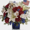 Red roses and carnations, white lilies and Blue Chrysanthemums, fillers and greens.