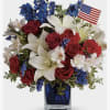 Red roses and carnations, white lilies and Blue Chrysanthemums, fillers and greens.