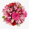 Red Roses, Hot Pink Roses, Pink Lilies and Alstroemeria, and Greens. Clear