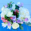 White roses, Hydrangeas, Mum cushion, Lavender or Pink Spray roses, Pink alstroemeria