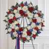 Red and White Roses, carnation&#039;s, Blue Delphiniums and Chrysanthemums, Greens and fillers.

Standard