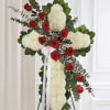 Beautiful Cross that radiates peace and purity.  With white mums Chrysanthemums