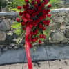 Beautiful Sympathy flower arrangement with 24 Red Roses, Purple Gladioli, Eucalyptus, Limonium