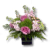 Lavender roses, stock, peach berries, green dianthus, and green. Clear Square vase.
