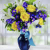 Yellow Roses, White Lilies, Purple Statice, Montecasino, and greens in Cobalt Blue