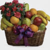 Beautiful basket with elegant fresh fruit, nuts and one cider apple Sparkling.