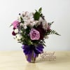 A stunning vase arrangement filled with soft and elegant blooms. This design