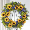 Vibrant yellow sunflowers with beautiful blue delphinium make this wreath the perfect
