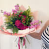 A bouquet of flowers in shades of pink full of love.
Made and