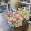 This pastel flower basket is designed to capture the beauty of a