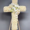 This elegant sympathy arrangement features a beautifully crafted cross made entirely of