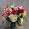 A lush mix of light pink and hot pink roses, paired with