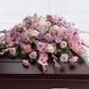 This graceful and elegant casket spray is a gentle tribute to a