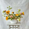 Earthy yet refined, our &quot;Sweet and Sunny&quot; floral arrangement for a radiant