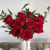One Dozen vibrant red roses beautifully arranged to express love and devotion.