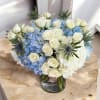 A serene and timeless arrangement that captures the beauty of a clear