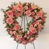 This beautifully arranged, heart shaped, wreath will convey your thoughtful expressions of