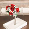 Red spray roses, sheer ribbon, white or light pink filler flower on