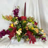 This lovely Thanksgiving or fall centerpiece features warm autumn colors and a
