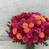 This lush beautiful arrangement is carefully crafted with 60 long stem roses