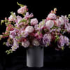 A serene and enchanting floral arrangement inspired by the soft, radiant hues