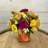 A cute and colorful arrangement of spring flowers. Perfect for a desktop