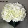 As shown: Hydrangeas arranged in a glass cube. 
** Deluxe: More hydrangeas.
**