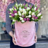 In our signature pink medium box . 75 tulips