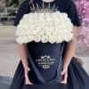 White roses in our signature black box with the sharp dark crown