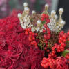 Beautiful red arrangement of fresh premium flowers in our signature black velvet
