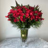 Beautiful arrangement with 100 Red roses in our tall Extravagant Vase