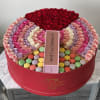 Colorful Roses in our signature round box with macaroons and champagne 