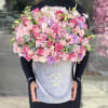 Beautiful arrangement of pink shades flowers in our signature velvet grey box